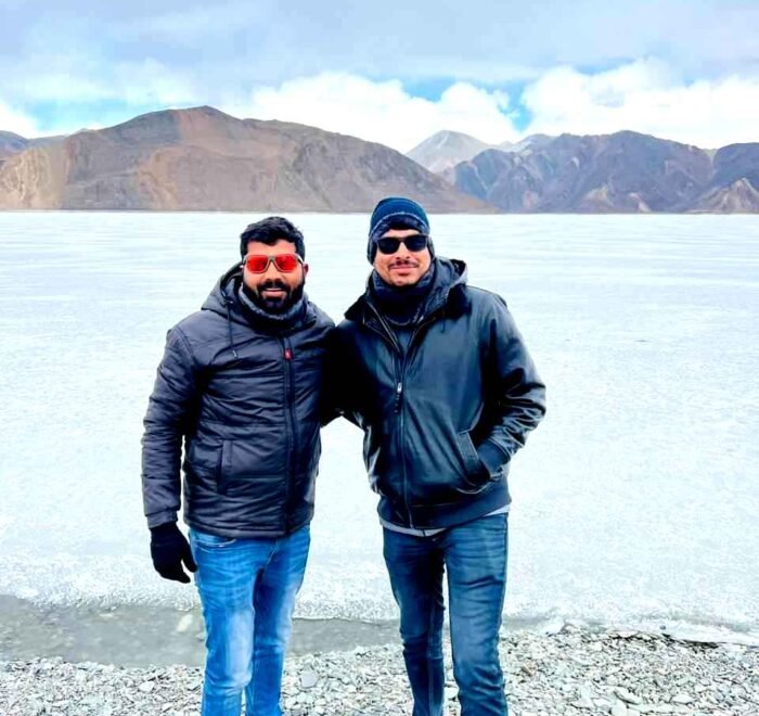 Bikers enjoying the tranquil morning at Pangong Lake